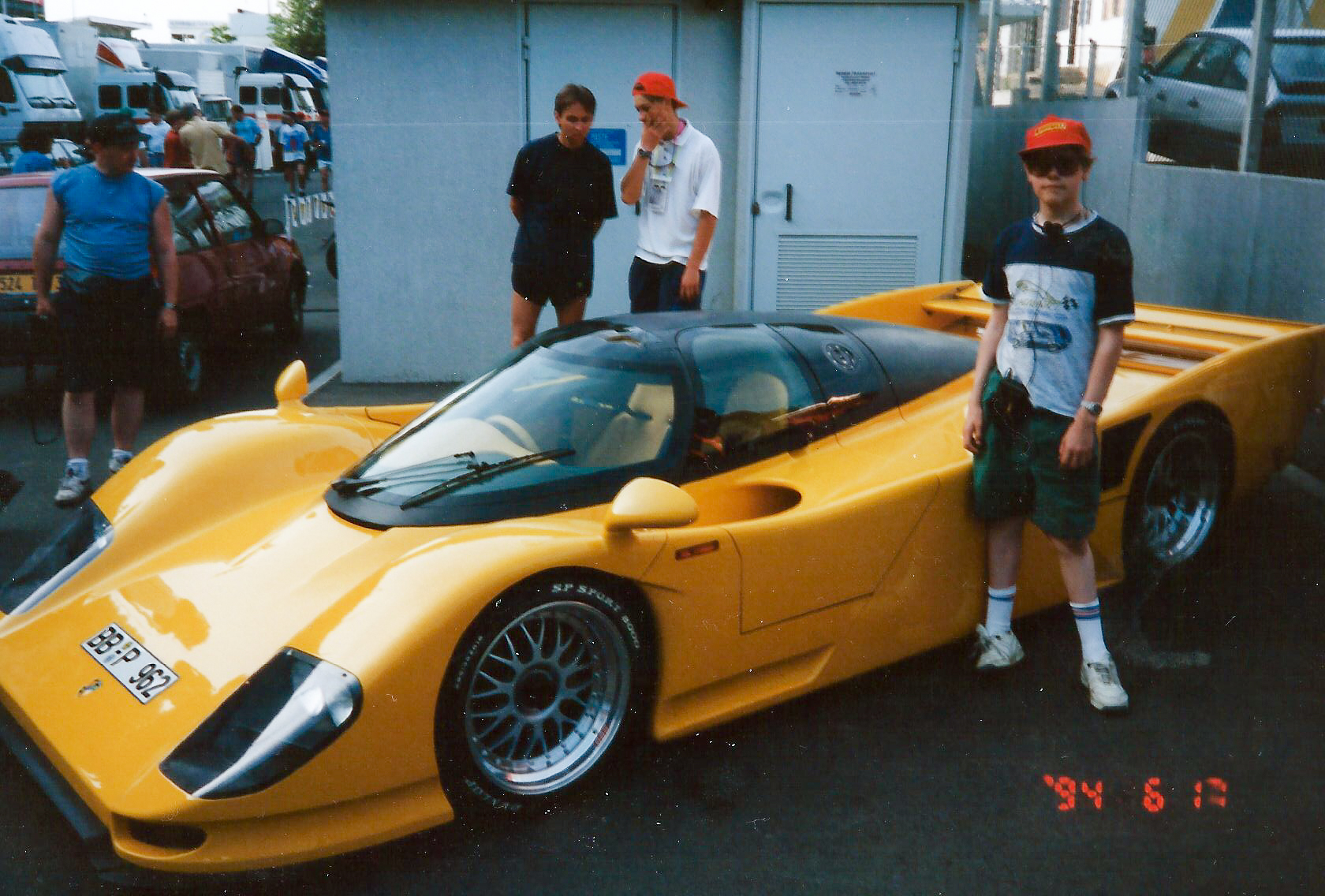 Me standing next to a road going Porsche 962 at Lemans in 1994